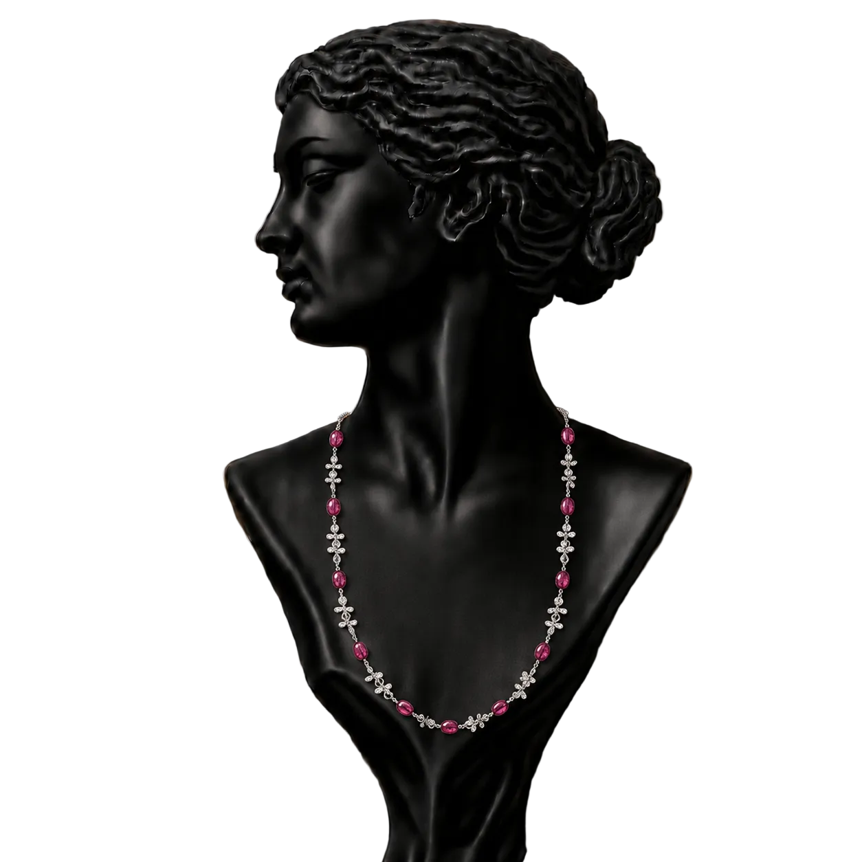 A black classical-style bust wearing a delicate necklace with alternating pink gemstones and silver-toned floral motifs,