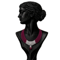 A black mannequin bust wearing a multi-strand necklace with deep magenta beads, a silver-toned pavé-style center, and a dangling magenta teardrop charm.